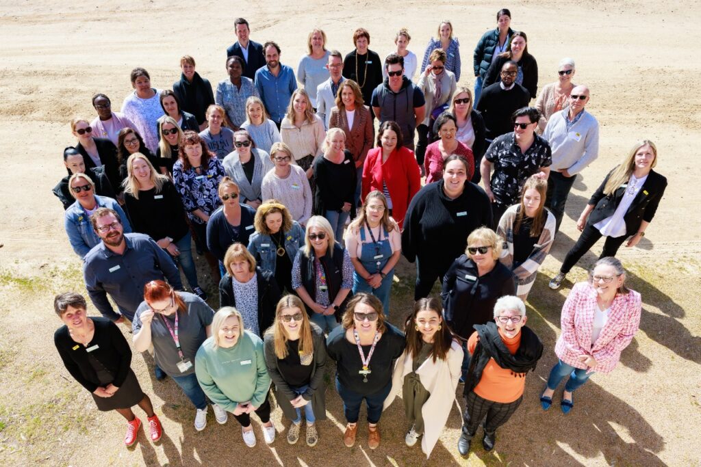 group of people standing as a team