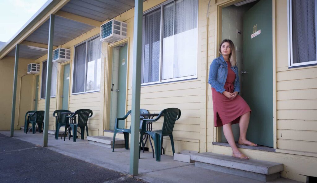 Woman outside of house